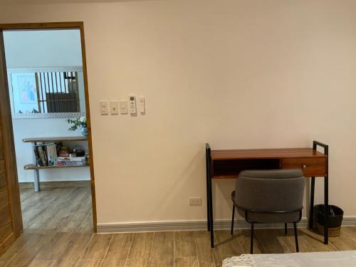 a mirror and a desk and a chair in a room at Puntakana Apartelle Spacious Apartment Panglao in Panglao