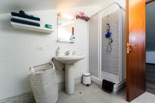 a bathroom with a sink and a shower at LA SOFFITTA DEI SOGNI 010059-LT-2481 in Sestri Levante
