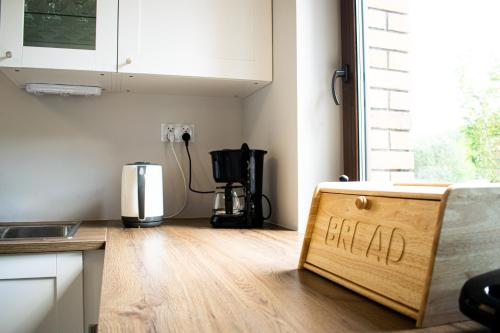 a kitchen with a field sign on the floor at Stacja Miśków in Wilków Nowy