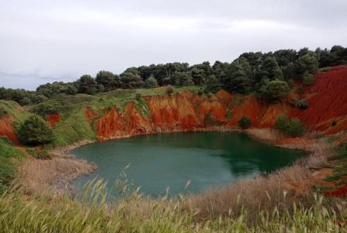 a small pond in the middle of a field at Tenuta San Lorenzo in Otranto