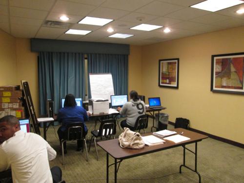 a group of people sitting in a room with computers at Holiday Inn Express Hotel & Suites Atlanta East - Lithonia by IHG in Lithonia