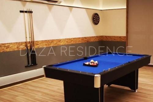 a ping pong table in a room with a pool table at DAZA RESIDENCE @ TIMURBAY SEAFRONT KUANTAN in Kuantan