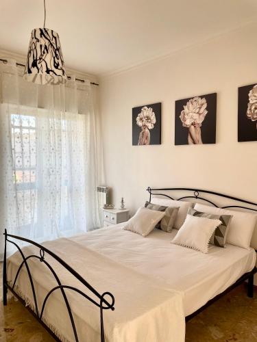 Postel nebo postele na pokoji v ubytování Casa De Curtis