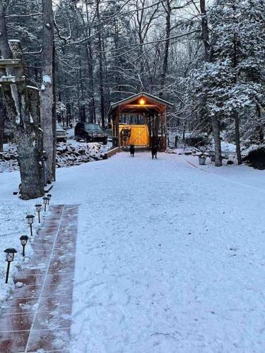 a gazebo covered in snow in a park at Peaceful Gateway to Island Creek Cottage in East Stroudsburg