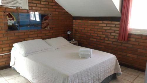 Postel nebo postele na pokoji v ubytování Pousada Casa de Praia