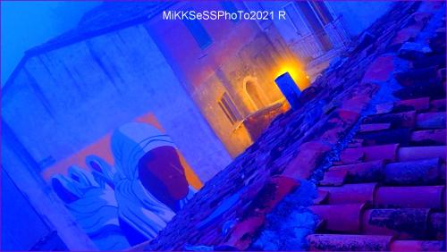 a light on the side of a building with stairs at Casa Vacanze Piazza Apartment 2 in SantʼAndrea di Conza