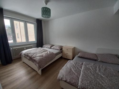 Postel nebo postele na pokoji v ubytování Zlatá Olešnice, pomezí Jizerek a Krkonoš
