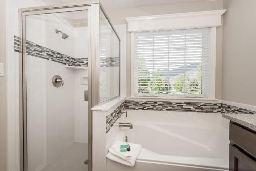 a white bathroom with a shower and a window at Family Getaway-Skiing, Ice Castles & Golf Course 2204 apts in Midway