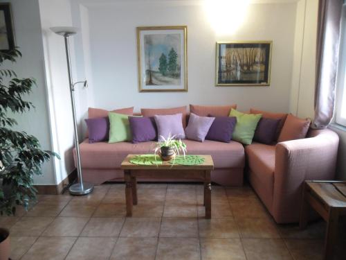 a living room with a couch and a table at Mirta in Stara Baška