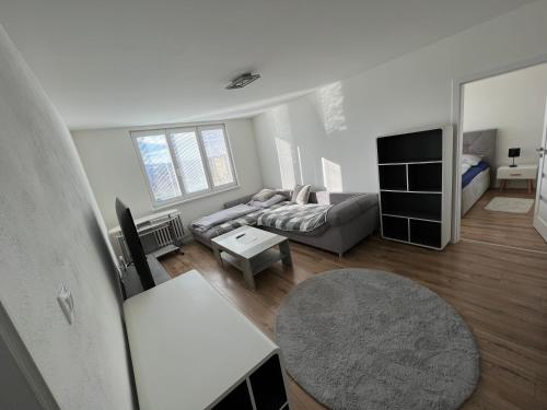 a living room with a couch and a table at Čisto nový dvojizbový apartmán v super lokalite in Nitra