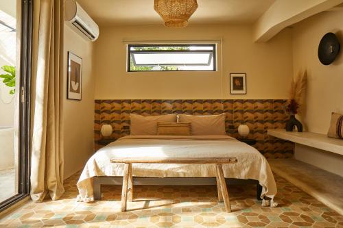 a bedroom with a bed and a table at DUNA by DW in San Juan