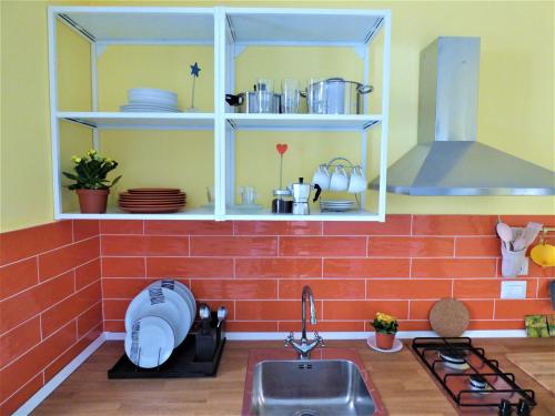 a kitchen with a sink and a counter top at Napoletando b&b in Naples