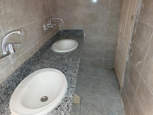 a bathroom with a sink and a toilet at Hayaat siwa hot spring in Siwa
