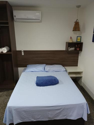 Кровать или кровати в номере SEGUNDA CASA - Seu cantinho em Guarapari, 1 minuto a pé da Praia do Morro! Suítes confortáveis e modernas - Para casal ou para grupos de até 4 pessoas