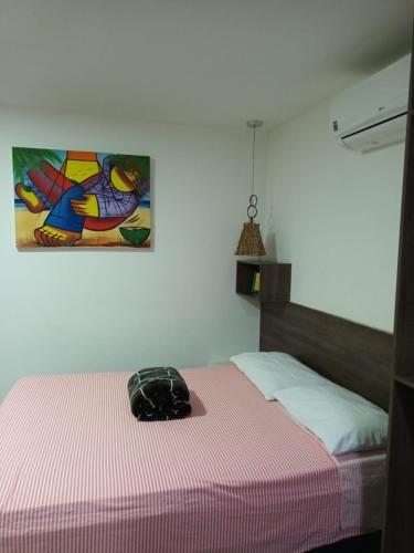Кровать или кровати в номере SEGUNDA CASA - Seu cantinho em Guarapari, 1 minuto a pé da Praia do Morro! Suítes confortáveis e modernas - Para casal ou para grupos de até 4 pessoas