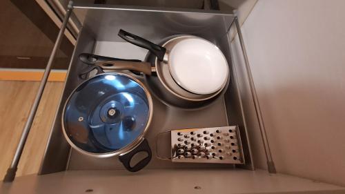 a blue sink in a metal box with a mirror at Apartment 183 Stubaital in Fulpmes