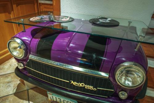 a purple car with a glass table on top at Hotel Rio Bianco in Panchia
