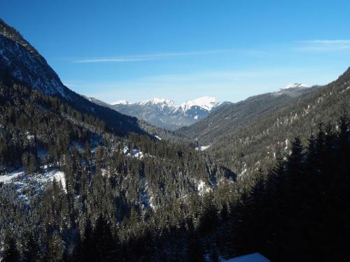 an aerial view of a mountain valley with snow at Ferienwohnung Abendrot in Berwang