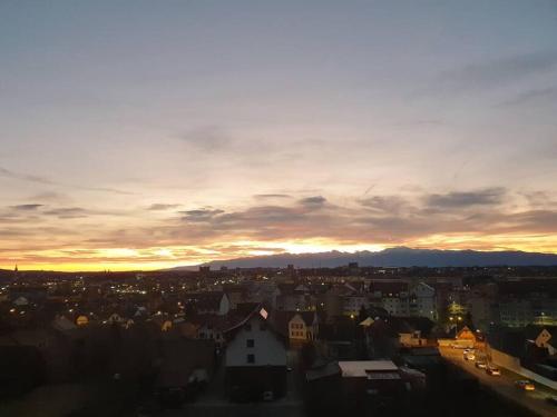 a view of a city at sunset at Leaf House in Sibiu