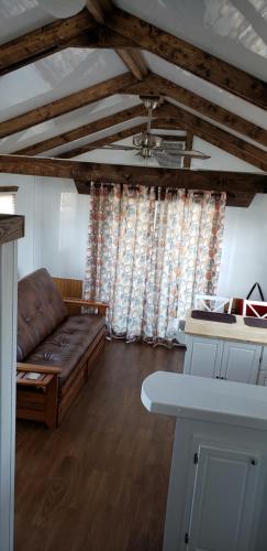 a living room with a couch and a table at Old Wooden Bridge Resort & Marina in Big Pine Key