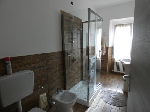 a bathroom with a shower and a toilet and a sink at Agriturismo Why Farm in Marano Ticino