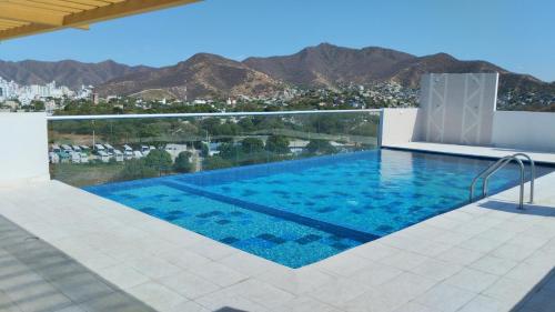 The swimming pool at or close to WiFi 300M, Parqueadero gratis, Piscina gratis, Llegada autónoma