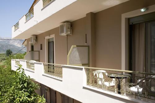 a balcony of a building with a view at Isalos in Vasiliki