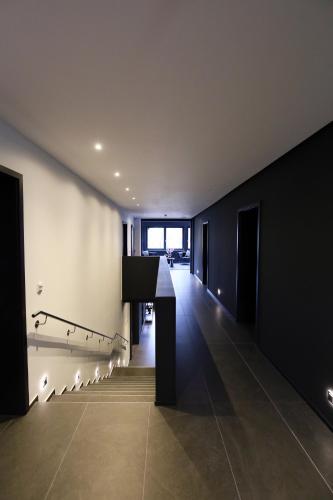a hallway of a building with a table and lights at Sellmann´s Boutique Hotel in Dortmund
