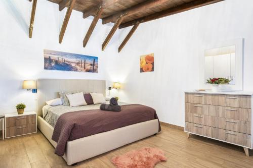 a bedroom with a bed and a dresser at Villa Colmena by Villa Plus in Guía de Isora