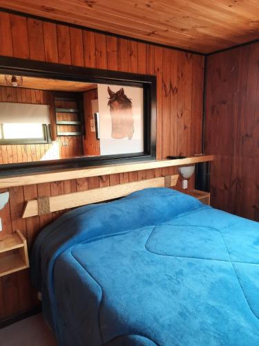 Postel nebo postele na pokoji v ubytování PUNTA DE TRALCA SUITES