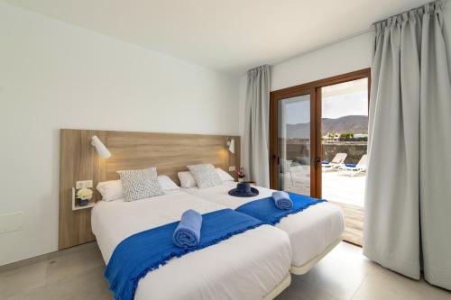 En eller flere senger på et rom på Villa Montane by Villa Plus