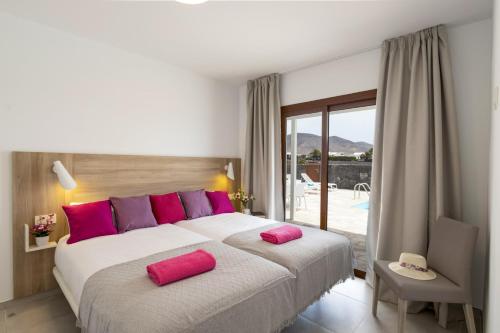 A bed or beds in a room at Villa Muzu by Villa Plus
