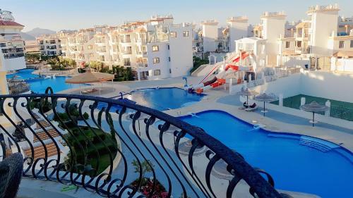 a view from the balcony of a resort with a water park at Sharm Hills Resort in Sharm El Sheikh