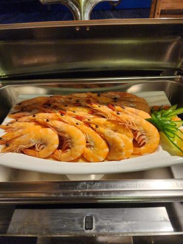 a plate of food sitting in an oven at Island Paradise Resort Club in Koror