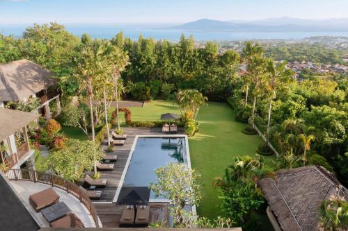 an aerial view of a villa with a swimming pool at Villa Uma Nina by Nakula in Jimbaran
