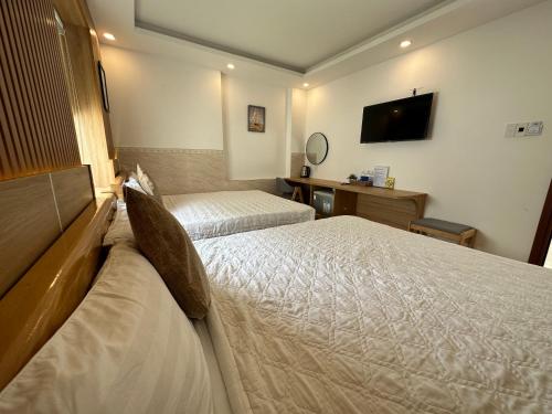 Cama o camas de una habitación en Ngọc Anh Hotel