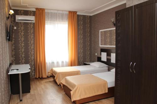 Кровать или кровати в номере Отель Премьер