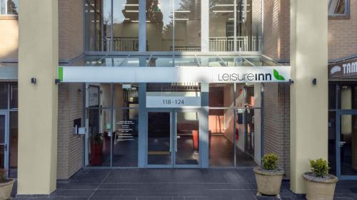 an entrance to a building with a sign that reads les institution at Leisure Inn Spires in Leura