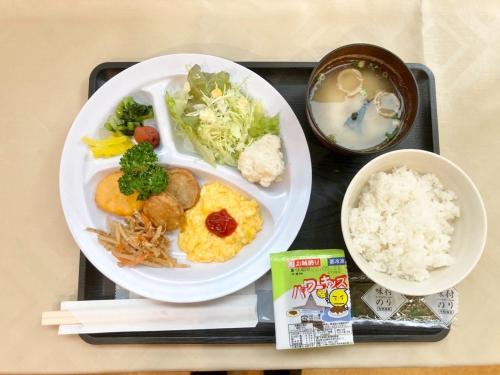 a tray with a plate of food and a bowl of rice at Miyazaki Five Seas Hotel - Vacation STAY 09454v in Miyazaki