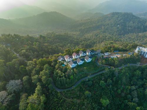 an aerial view of a house in the middle of a forest at Sprise Munnar Resort and Spa in Munnar