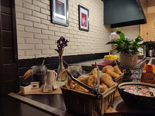 a table with a tray of food on a counter at Hôtel Inn Design Resto Novo Bourges in Bourges