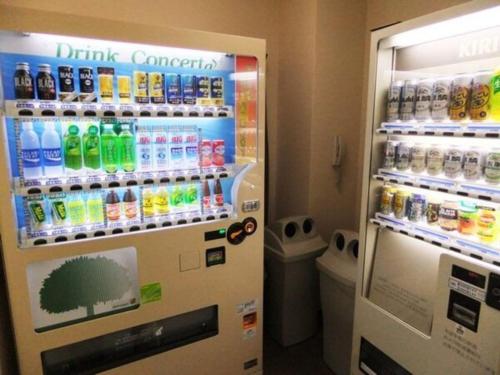 a vending machine filled with lots of bottles of soda at Miyazaki Five Seas Hotel - Vacation STAY 09454v in Miyazaki