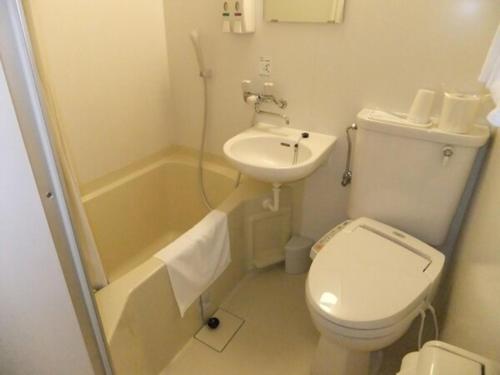 a small bathroom with a toilet and a sink at Miyazaki Five Seas Hotel - Vacation STAY 09459v in Miyazaki