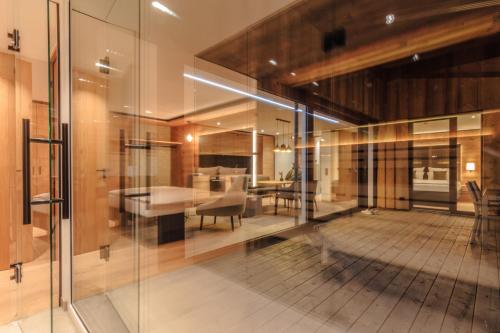 a room with a table and a dining room at Wirthshof Hotel & Chalets in Markdorf