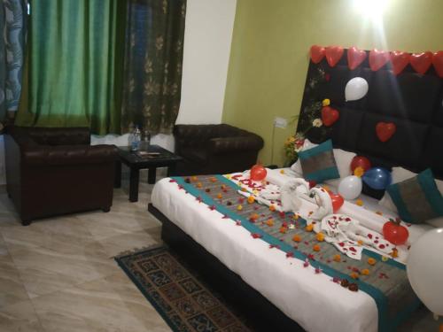 a bedroom with a bed with decorations on it at ROYAL BREEZE HOTEL & RESTAURANT Received Most Rated Traveller Award Property For Year 2023-2024 !! in Mussoorie
