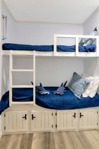 a room with two bunk beds with dolphins on them at Beach View & SeaBreezes in Corpus Christi