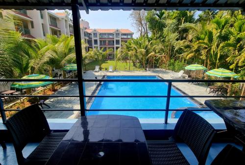 a view of a swimming pool from a hotel room at SUN N SEA Resort in Diveagar