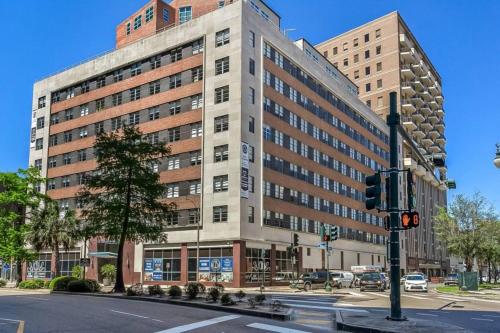 a large building on the corner of a street at Charming California Condos - Near it All in New Orleans
