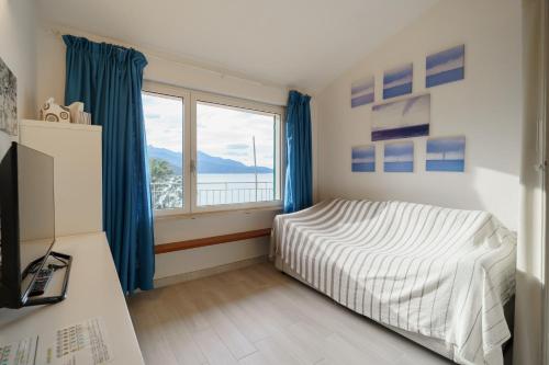 Postel nebo postele na pokoji v ubytování Terrazza sulla Biodola - Goelba