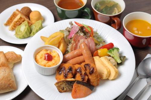 a white plate of food with different types of food at Urban Hotel Kyoto Gojo Premium in Kyoto